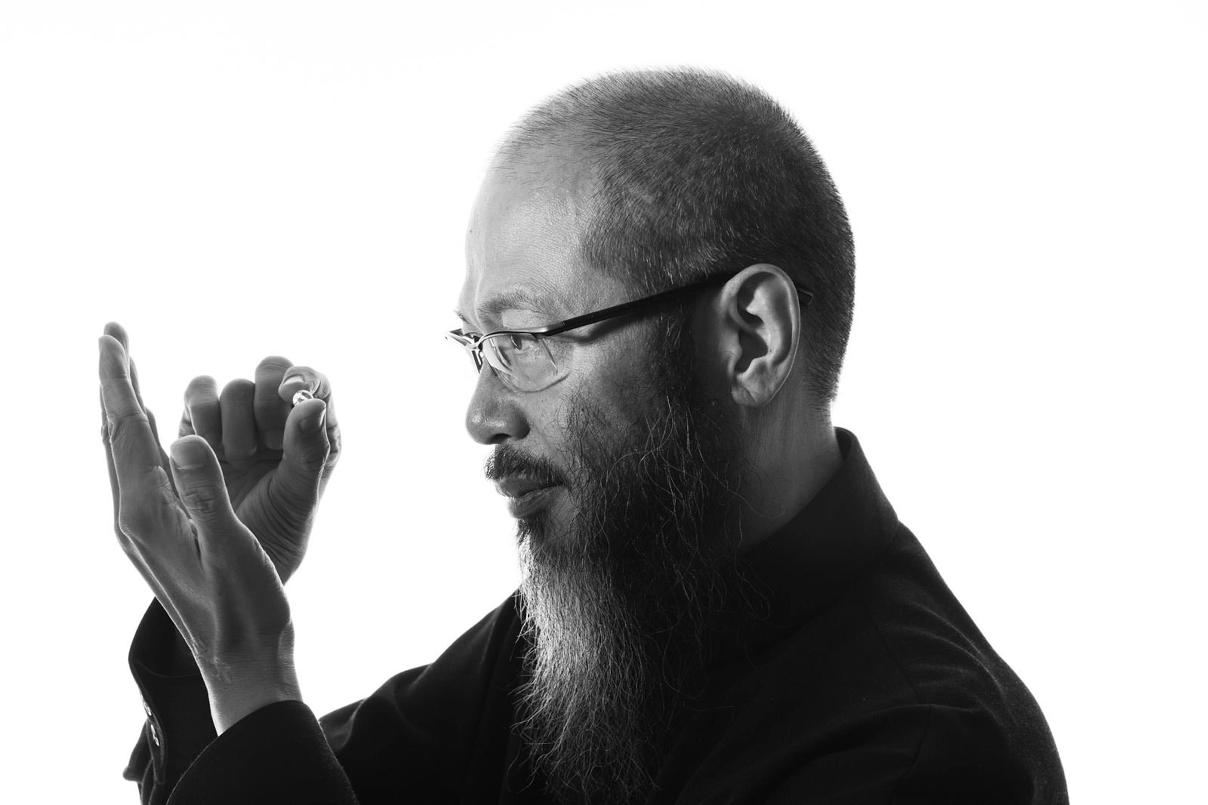 finger hand person beard face head adult male man glasses