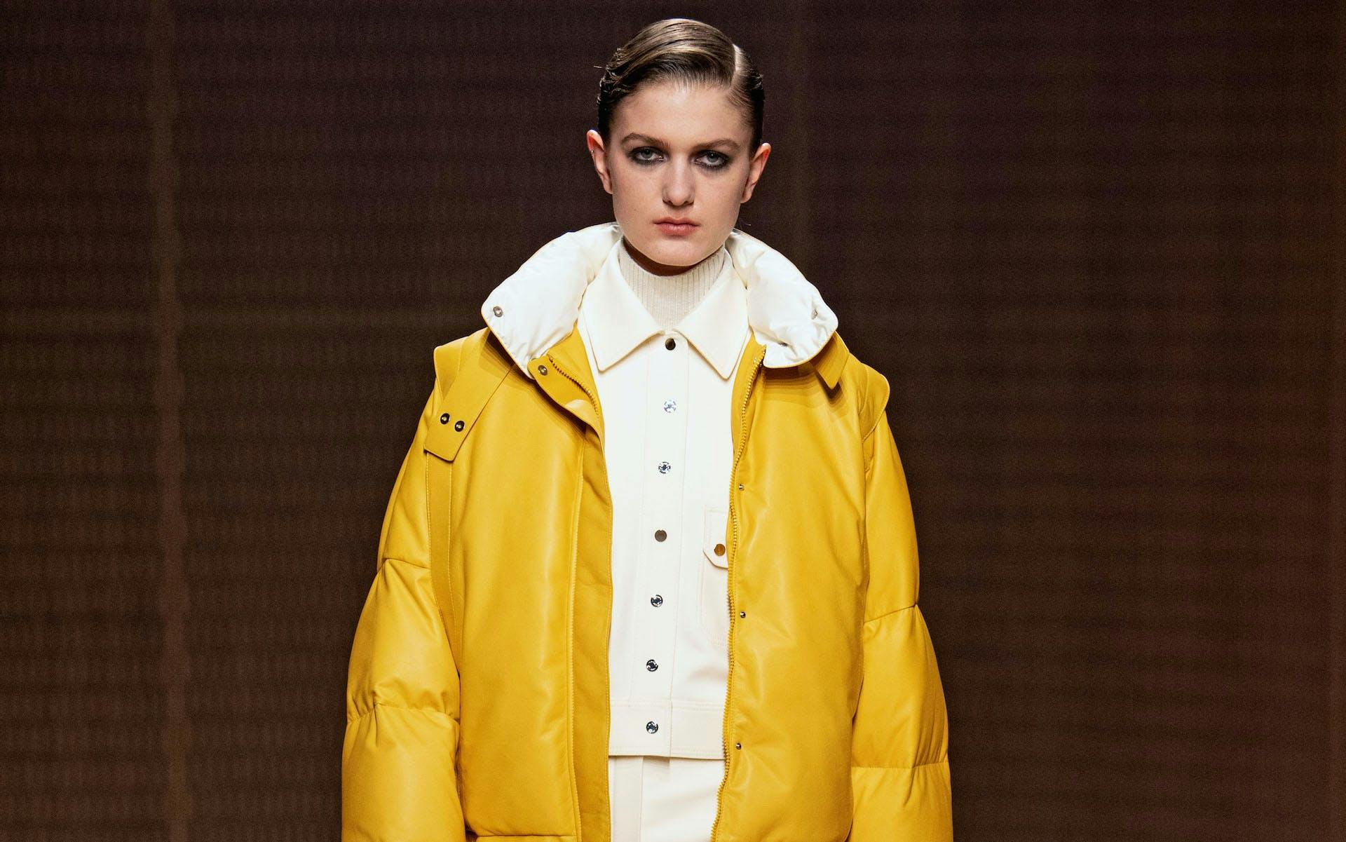 clothing apparel coat raincoat person human