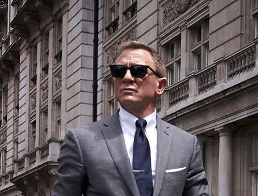 tie accessories clothing apparel person suit overcoat coat sunglasses man