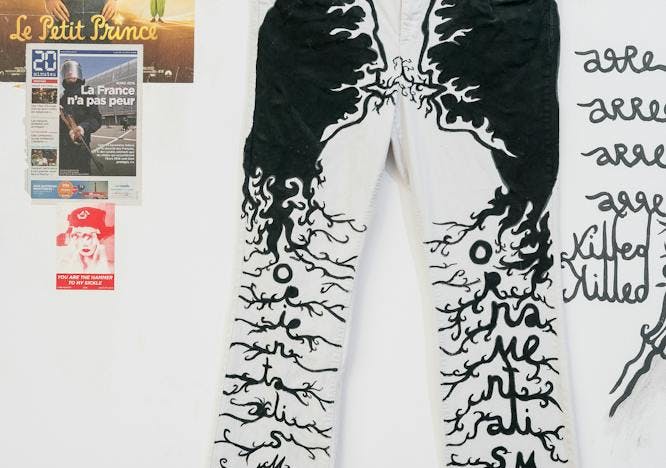 person human text pants clothing apparel poster advertisement