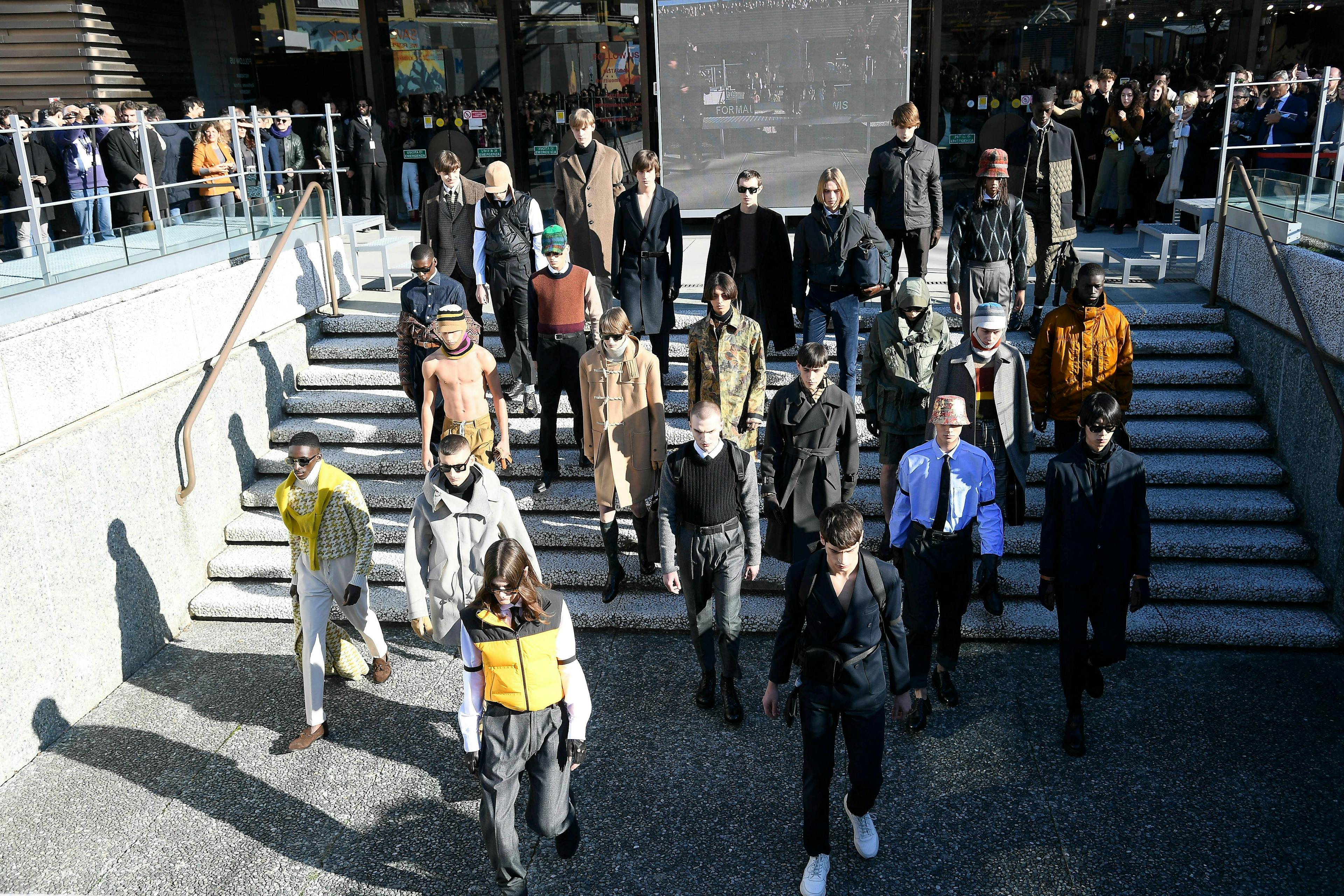 pedestrian person human clothing apparel tarmac overcoat coat suit crowd