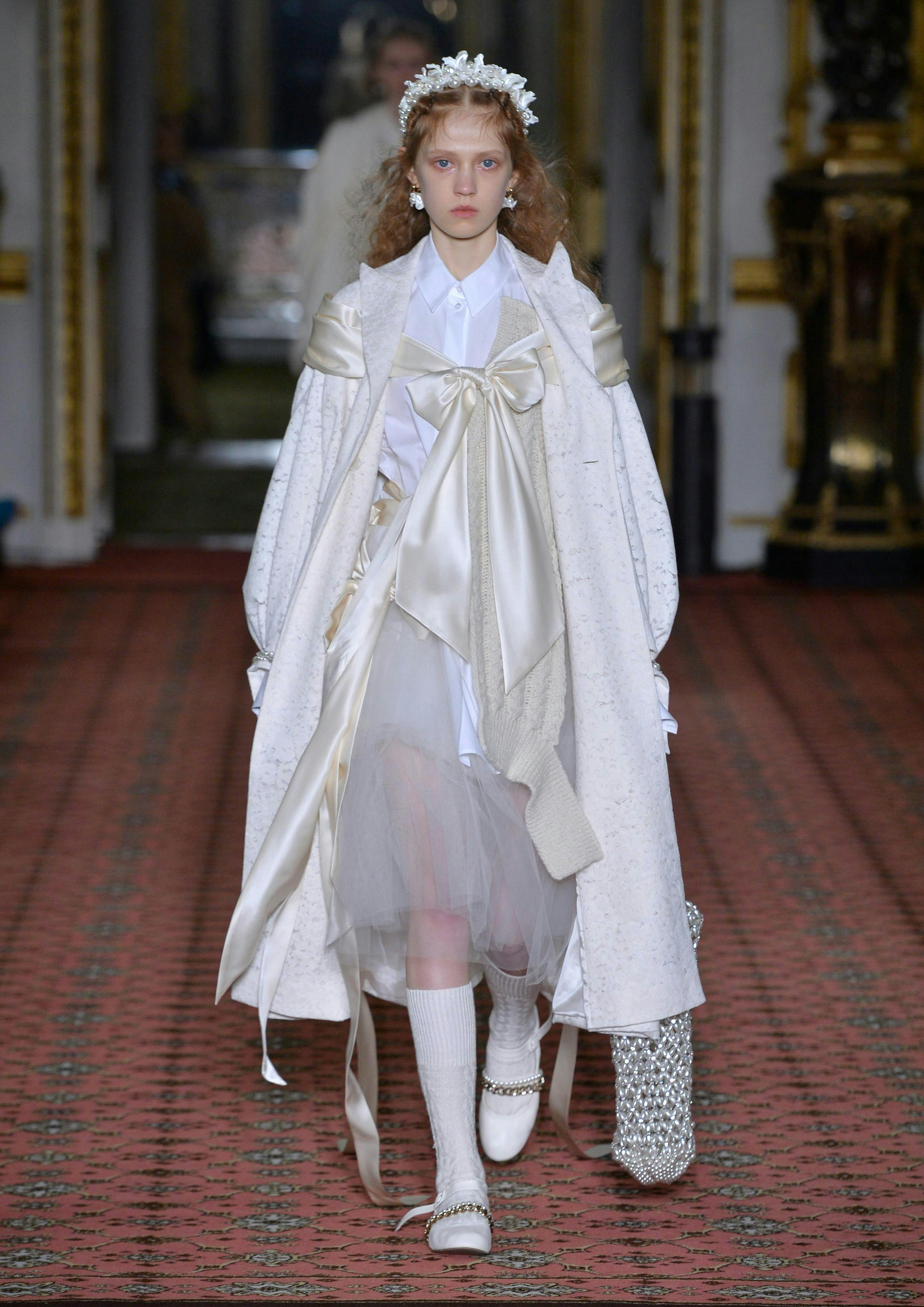 coat clothing apparel sleeve person human long sleeve fashion runway