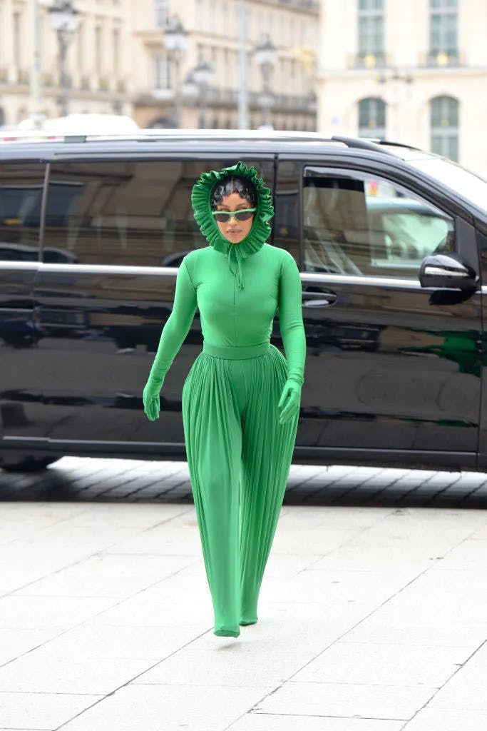 Cardi B in a green Richard Quinn catsuit at Paris Fashion week. Image: Getty Images