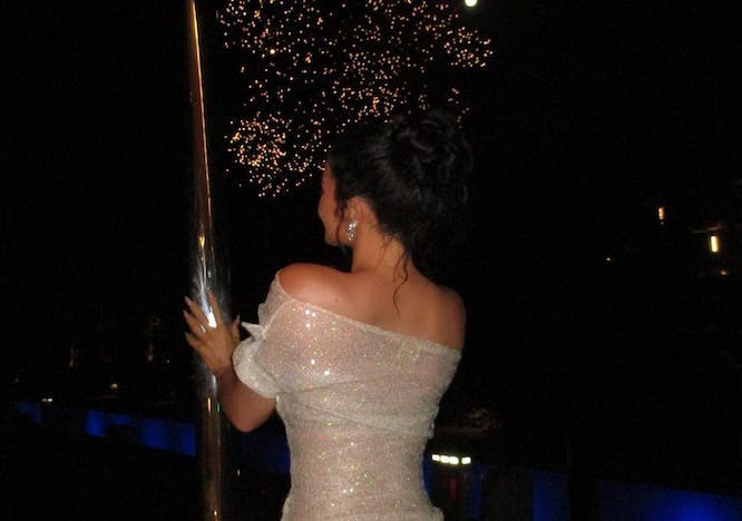 Kylie Jenner in a sparkly sheer dress while celebrating her 25th birthday.