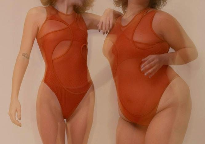 two models in a red subversive bodysuit