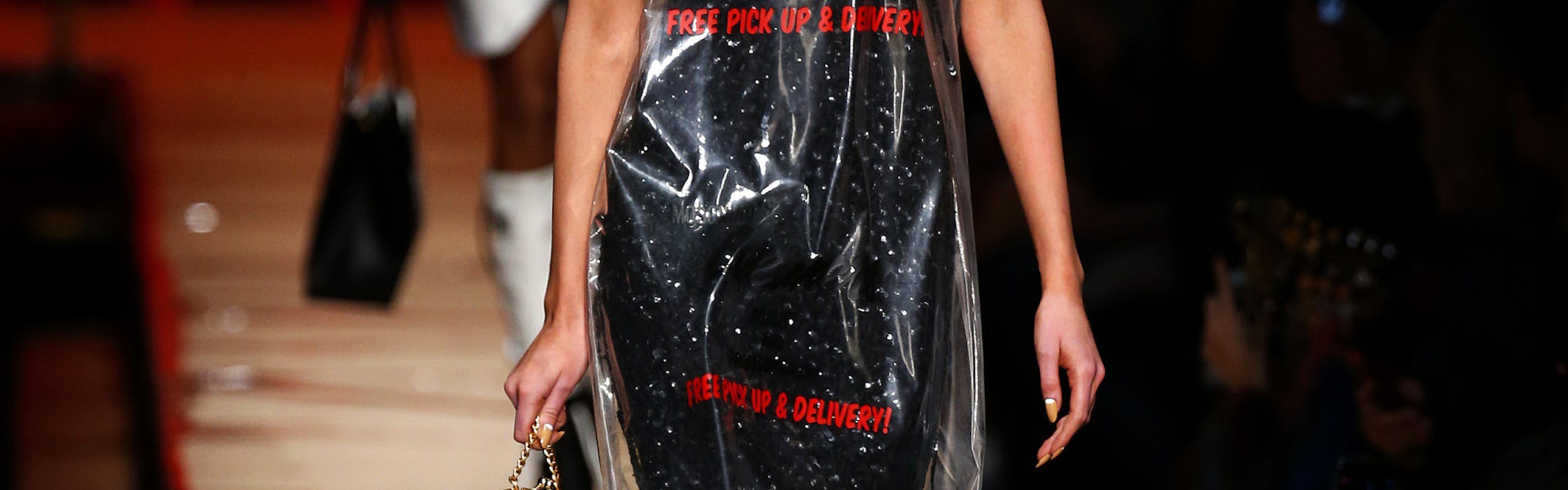 Model wearing the Moschino plastic dry cleaning bag dress