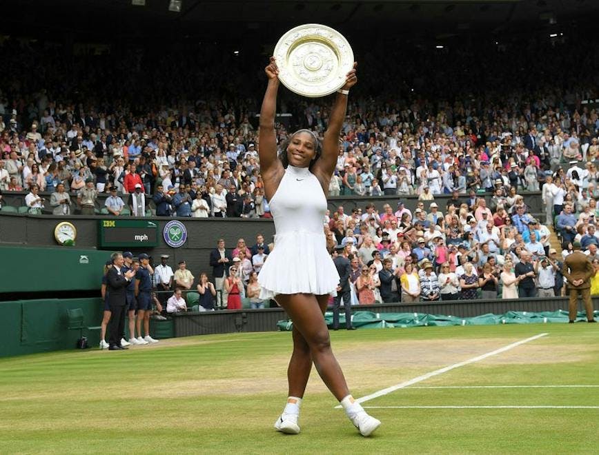 serena williams holding her trophy after wimbledon 2016 in a white dress